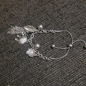 Elegant Silver Charm Bracelet with Leaf and Floral Accents